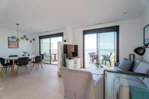 a living room with a couch and a table at House with Private Spa and Pool, with access to Sauna and Gym in Torrox Costa