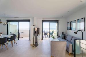 a living room with a couch and a table at House with Private Spa and Pool, with access to Sauna and Gym in Torrox Costa