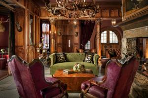 a living room with a couch and a table at Grand Bohemian Lodge Asheville, Autograph Collection in Asheville