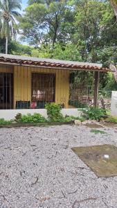 a yellow building with a roof on top of it at Casa en Santa Cruz a 40min de Tamarindo in Santa Cruz