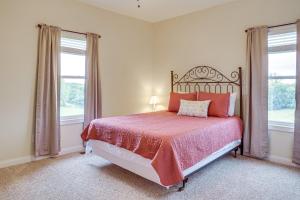 a bedroom with a bed and two windows at 14 Mi to Ark Encounter Rural Corinth Escape! in Corinth