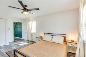a bedroom with a bed and a ceiling fan at Pet-Friendly Overland Park Condo with Pool Access! in Overland Park