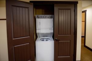 a washer and dryer in a room next to a door at Chase On The Lake in Walker