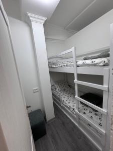 a small room with two bunk beds in it at Modern Yerevan Apartment-Brand New in Yerevan +21 photos