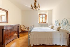 Ένα ή περισσότερα κρεβάτια σε δωμάτιο στο Casale Le Bimbe