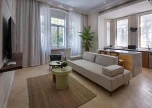 a living room with a couch and a table at Numero CINQ Fragrance Boutique Hotel in Cairo