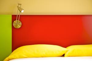 Postel nebo postele na pokoji v ubytování Ibis Styles Parma Toscanini