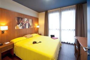 Postel nebo postele na pokoji v ubytování Ibis Styles Parma Toscanini