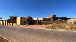 an empty street in front of a building at Hotel Itiquira in Formosa