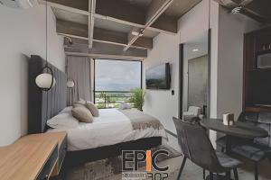 Μια τηλεόραση ή/και κέντρο ψυχαγωγίας στο Epic Suite 302 Deluxe Aeropuerto