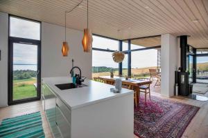 a kitchen with a view of the ocean from a house at 13380-Nykobing-Sj-Bag-Mollen-2 in Lumsås