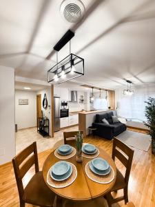 a living room with a table and chairs and a couch at San Marcos in Ribadeo