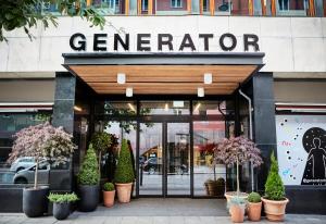 a store front of a store with potted plants at Generator Stockholm in Stockholm