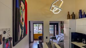 a kitchen and living room with a couch and a table at Urban Lofts Laureles 40 in Medellín