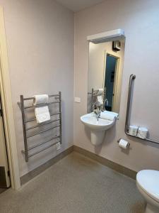 a bathroom with a sink and a toilet at Tekapo Ski Club Retreat in Lake Tekapo +24 photos