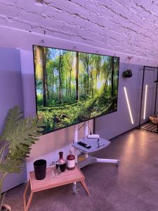 a large flat screen tv hanging on a wall at soulfactory Gewölbe in Neu-Ulm