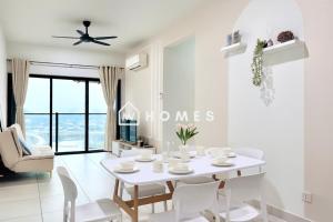 a white dining room with a white table and chairs at Majestic Maxim 3Bedroom near UCSI MRT #28 in Cheras