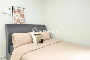 a bedroom with a bed with a grey headboard at Majestic Maxim 3Bedroom near UCSI MRT #28 in Cheras +19 photos