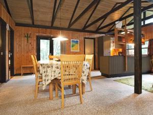 a dining room with a table and chairs at Holiday Home Escape in Scenic Rodby in Rødby