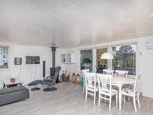 a living room with a white table and chairs at 5 person holiday home in Hals-By Traum in Hals