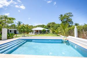 an image of a swimming pool at a house at Casa Palma El Limon Samana in El Limón