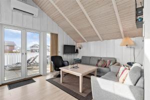 a living room with a couch and a table at 0289-Romo-Vestergade-3-Ap-18 in Havneby
