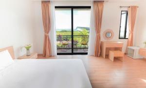 Postel nebo postele na pokoji v ubytování Hometown An Viên Prime Villa Hoi An + 26 fotografií