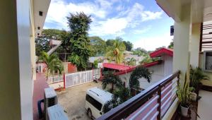 a balcony of a house with a view of a street at Pring Pension House Puerto Princesa in Puerto Princesa City