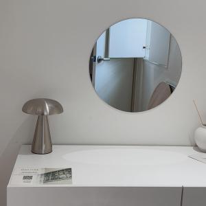 a mirror on the wall above a bathroom counter at Staymoment in Seoul