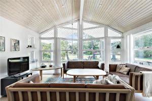 a living room with a couch and a table at 11153-Nykobing-Sj-Lyngvejen-27 in Nykøbing Sjælland