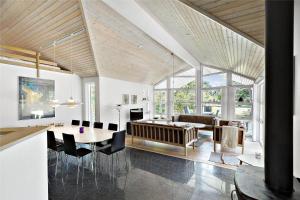 a living room with a table and a couch at 11153-Nykobing-Sj-Lyngvejen-27 in Nykøbing Sjælland