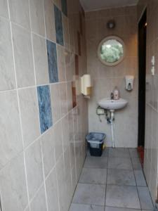 a bathroom with a sink and a toilet at MARATHIAS BEACH MISS ASIMENIA One empty pitch for your RV ΜΙΑ ΘΕΣΗ CAMBING RV in Milina