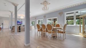a dining room with a table and chairs at VIP Mansion Estate in Blakeslee