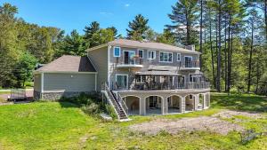 a large house with a porch and a deck at VIP Mansion Estate in Blakeslee