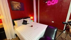 a person taking a picture of a bed with a camera at Dream Hotel Hà Nội in Hanoi +41 photos