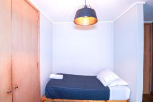 Voodi või voodid majutusasutuse HOM I Parking y Piscina temperada para 4 Pax toas