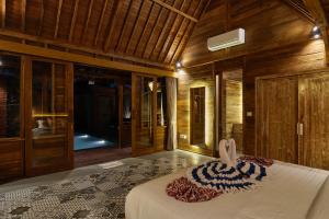 Katil atau katil-katil dalam bilik di Bali Holiday Ubud