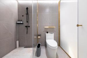 a bathroom with a toilet and a shower at Atour X Hotel, Dongguan Street, Daming Lake,Jinan in Jinan