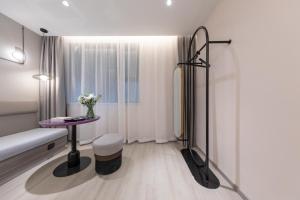 a small room with a table and a window at Atour X Hotel, Dongguan Street, Daming Lake,Jinan in Jinan