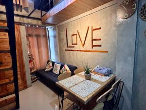 a living room with a table and a couch at LoftVibes San Juan - 1 in San Juan +30 photos
