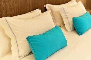 Giường trong phòng chung tại Mariel Hotel Boutique