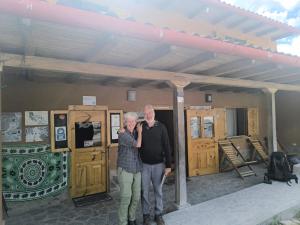 an older man and woman standing in front of a building at MuyaKuelap - Vive la experiencia Amazonas in Nuevo Tingo