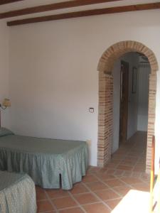 Postel nebo postele na pokoji v ubytování Hotel Rural Casares