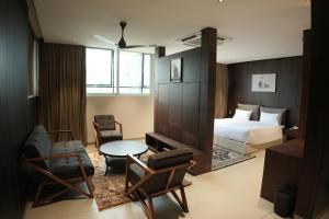 Postel nebo postele na pokoji v ubytování Jas Grand Inn + 72 fotografií