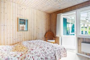 a bedroom with a bed and a window at 8007-Knebel-Soren-Jeppesens-Vej-5 in Knebel