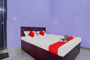 Ένα ή περισσότερα κρεβάτια σε δωμάτιο στο Collection O Clement Holydays