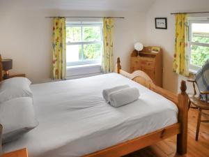 Postel nebo postele na pokoji v ubytování Holly Cottage + 7 fotografií
