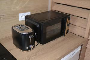a toaster oven sitting on a counter in a kitchen at La Parenthèse in Saint-Omer