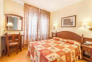 Säng eller sängar i ett rum på Montecarlo