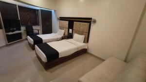 Ένα ή περισσότερα κρεβάτια σε δωμάτιο στο Collection O Chatrapati Shivaji Bus Terminal Aurangabad